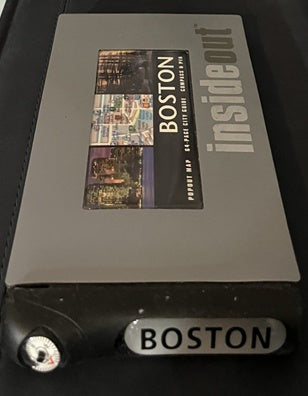 Gray book or notebook with 'Boston' branding on a black background